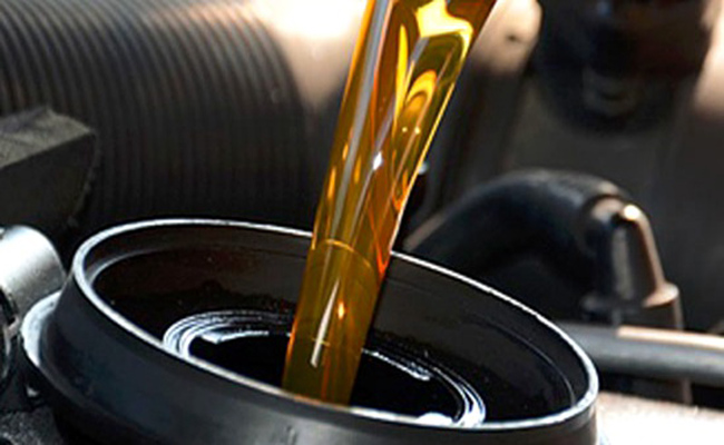 How often should the air compressor lubricating oil be changed?